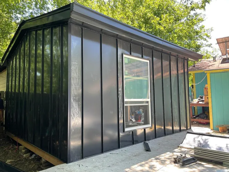 Black standing seam metal wall panels for Roof Inspection in Finley