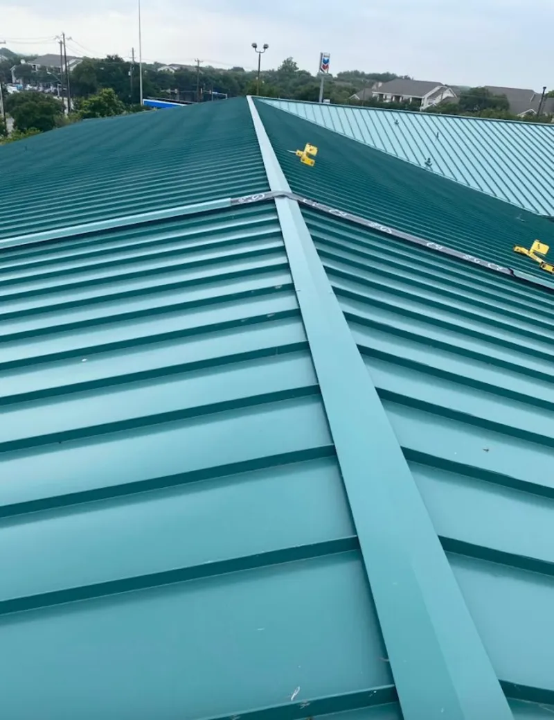 Green commercial metal roof ridge and valley for Metal Roof Repair in Finley